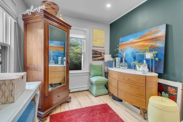 3 Makamah Beach Rd, Northport, NY 11768 - bathroom with a baseboard heating unit and wood finished floors