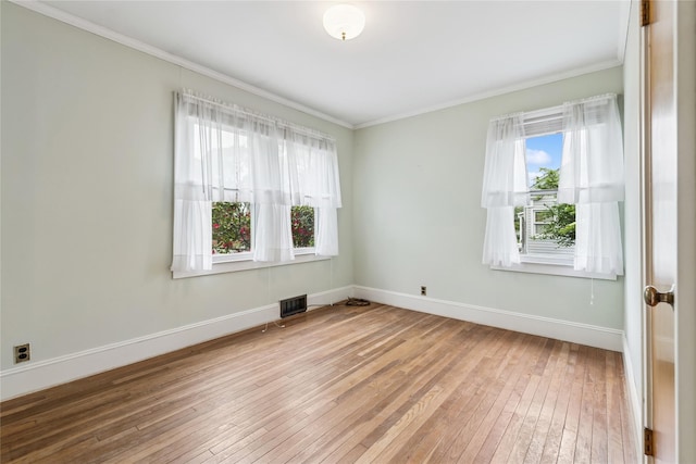 142 Woodhull Ave, Riverhead, NY 11901 - empty room with hardwood / wood-style flooring, ornamental molding, and baseboards