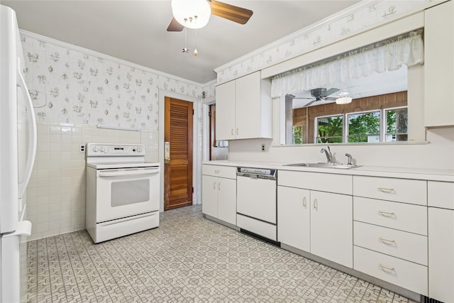 142 Woodhull Ave, Riverhead, NY 11901 - kitchen featuring white appliances, wallpapered walls, a sink, ceiling fan, and light countertops