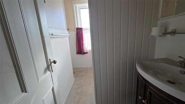 25 E Broome St, Port Jervis, NY 12771 - bathroom with vanity and tile walls