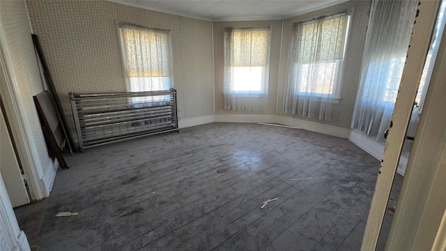 25 E Broome St, Port Jervis, NY 12771 - empty room with crown molding, wood-type flooring, baseboards, and wallpapered walls