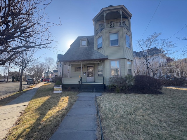 25 E Broome St, Port Jervis, NY 12771 - victorian house with a porch, a balcony, and a front lawn