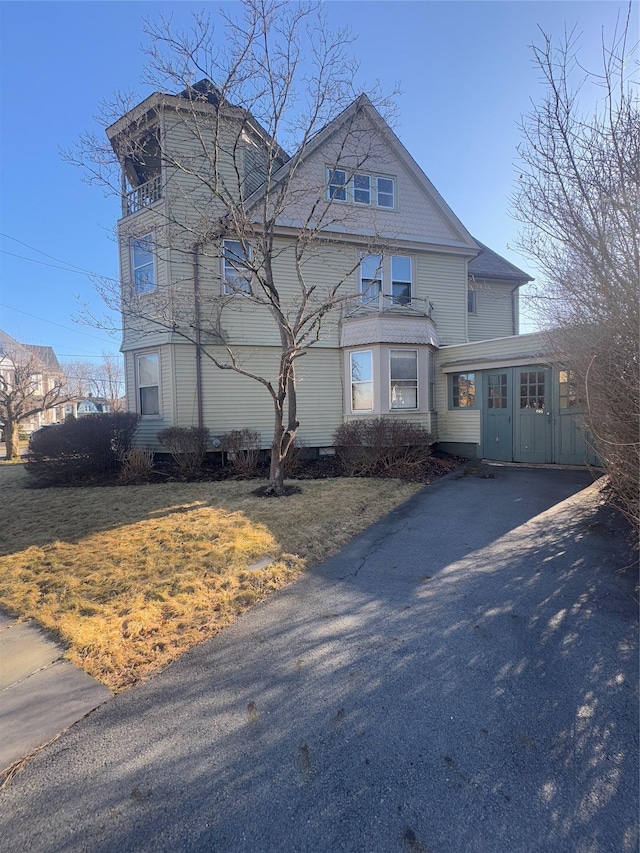 25 E Broome St, Port Jervis, NY 12771 - view of front of property with asphalt driveway and a front yard