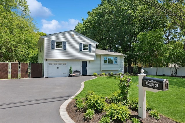 33 Elm St, Lake Ronkonkoma, NY 11779 - split level home featuring driveway and an attached garage