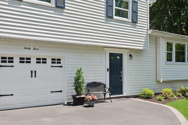 33 Elm St, Lake Ronkonkoma, NY 11779 - property entrance with a garage