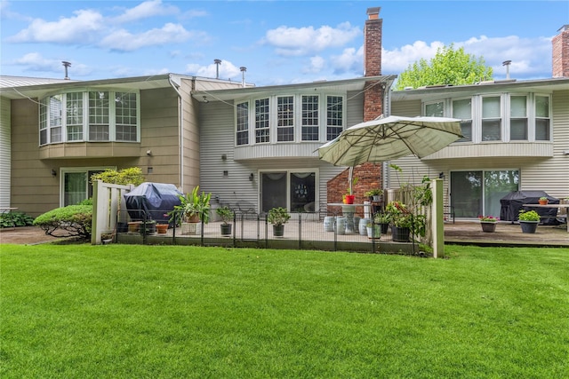31 Manors Dr, Jericho, NY 11753 - rear view of house featuring a lawn, a patio, and a chimney