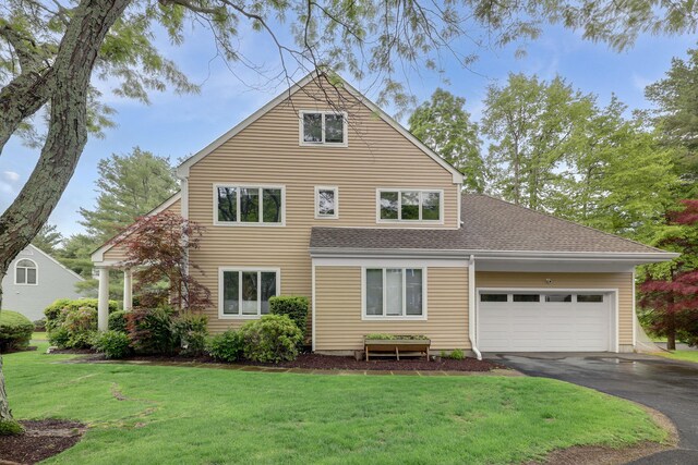 1 Berkley Ct, Briarcliff Manor, NY 10510 - back of property with asphalt driveway, a garage, a lawn, and a shingled roof