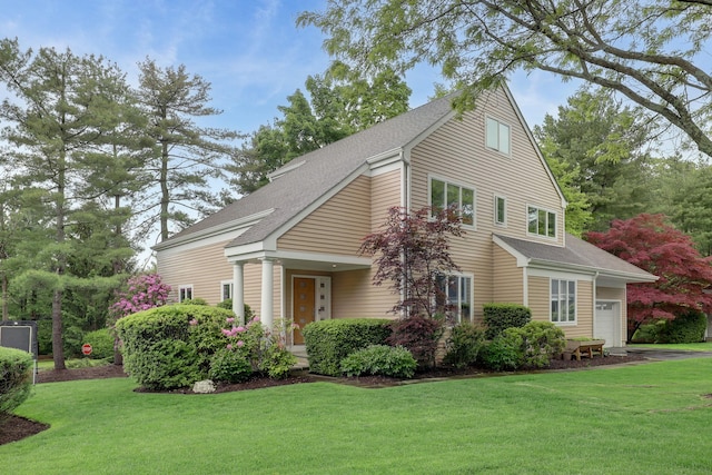 1 Berkley Ct, Briarcliff Manor, NY 10510 - view of front of property with a shingled roof, a front yard, and an attached garage