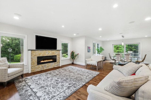 1 Berkley Ct, Briarcliff Manor, NY 10510 - living room featuring healthy amount of natural light, a fireplace, wood finished floors, recessed lighting, and baseboards
