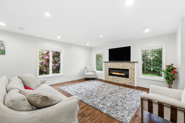 1 Berkley Ct, Briarcliff Manor, NY 10510 - living room with healthy amount of natural light, a fireplace, recessed lighting, wood finished floors, and baseboards