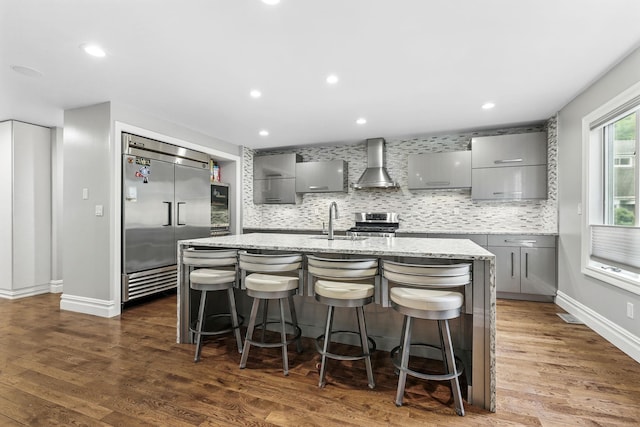 1 Berkley Ct, Briarcliff Manor, NY 10510 - kitchen featuring gray cabinetry, stainless steel appliances, wall chimney range hood, a sink, and recessed lighting