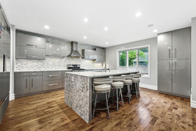 1 Berkley Ct, Briarcliff Manor, NY 10510 - kitchen featuring gray cabinets, wall chimney exhaust hood, gas stove, a sink, and recessed lighting