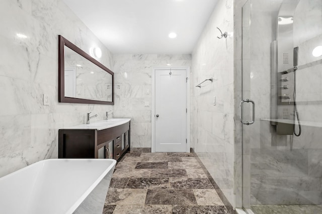 1 Berkley Ct, Briarcliff Manor, NY 10510 - bathroom with a soaking tub, a shower stall, vanity, and tile walls