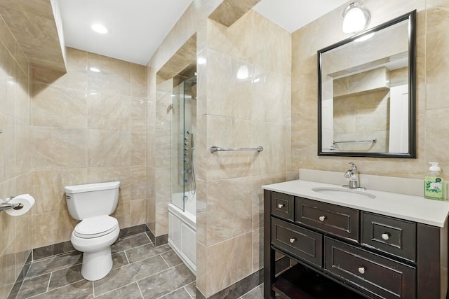 1 Berkley Ct, Briarcliff Manor, NY 10510 - full bath featuring tile walls, tiled shower / bath, vanity, toilet, and tile patterned flooring