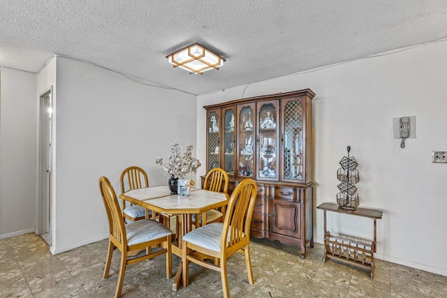 152-18 Union Tpke Unit 4G, Flushing, NY 11367 - dining area with a textured ceiling and baseboards
