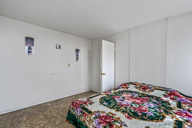 152-18 Union Tpke Unit 4G, Flushing, NY 11367 - bedroom with a textured ceiling and tile patterned floors