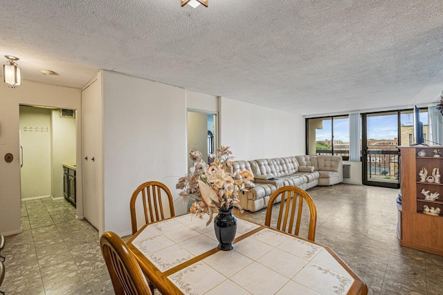 152-18 Union Tpke Unit 4G, Flushing, NY 11367 - dining area with a textured ceiling