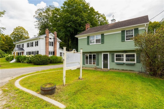 2-4 Hunns Lake Rd, Stanfordville, NY 12581 - colonial home with a front yard and a chimney