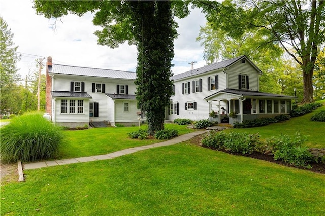2-4 Hunns Lake Rd, Stanfordville, NY 12581 - rear view of property with a chimney, a lawn, metal roof, and a porch