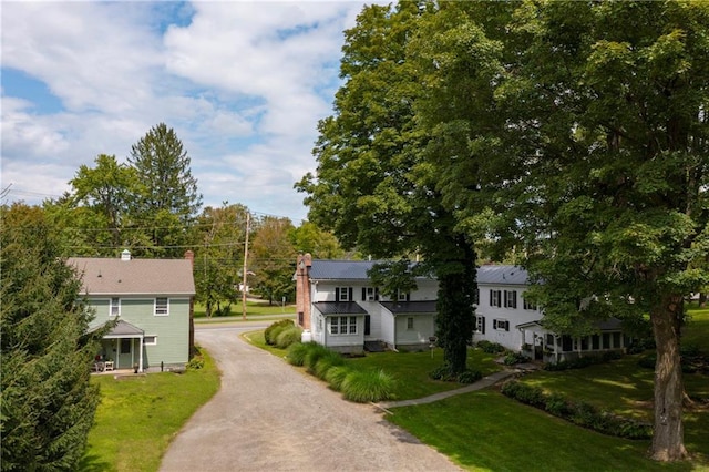2-4 Hunns Lake Rd, Stanfordville, NY 12581 - view of front of house featuring a front lawn, a chimney, and driveway