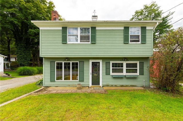 2-4 Hunns Lake Rd, Stanfordville, NY 12581 - colonial-style house featuring a front lawn, a chimney, and driveway
