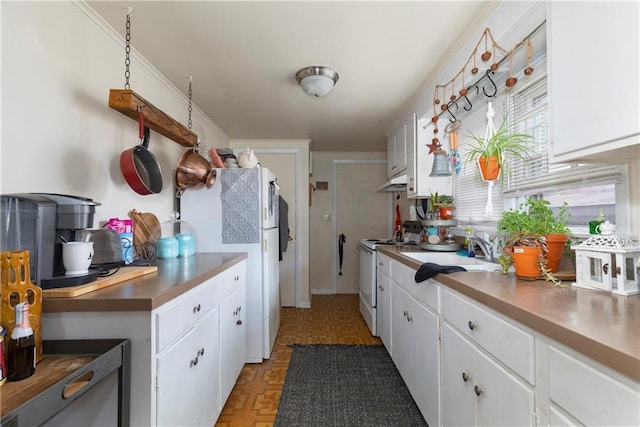 2-4 Hunns Lake Rd, Stanfordville, NY 12581 - kitchen with white appliances, white cabinetry, a sink, under cabinet range hood, and light floors