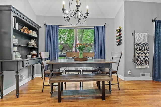 243 Albemarle Rd, White Plains, NY 10605 - dining area with a chandelier, light wood-type flooring, and baseboards