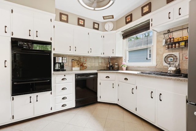243 Albemarle Rd, White Plains, NY 10605 - kitchen with black appliances, a warming drawer, a sink, and backsplash