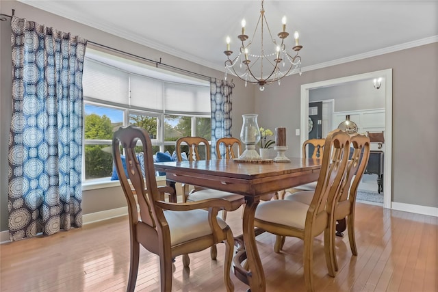 243 Albemarle Rd, White Plains, NY 10605 - dining room featuring a chandelier, hardwood / wood-style floors, ornamental molding, and baseboards