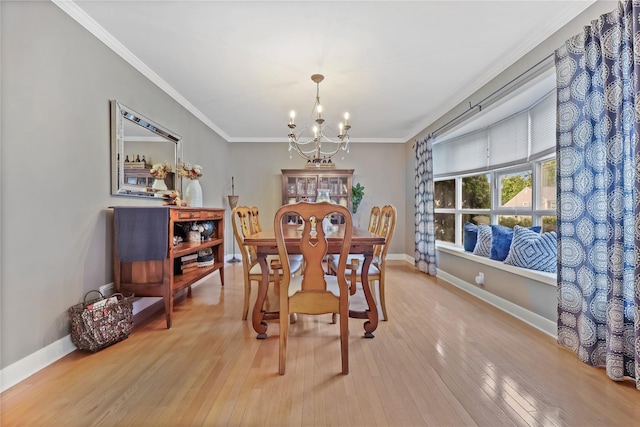 243 Albemarle Rd, White Plains, NY 10605 - dining area featuring a chandelier, light wood-type flooring, crown molding, and baseboards