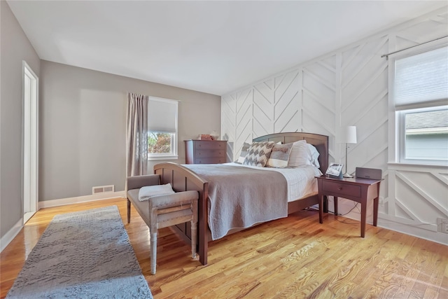 243 Albemarle Rd, White Plains, NY 10605 - bedroom with light wood-style flooring and a decorative wall