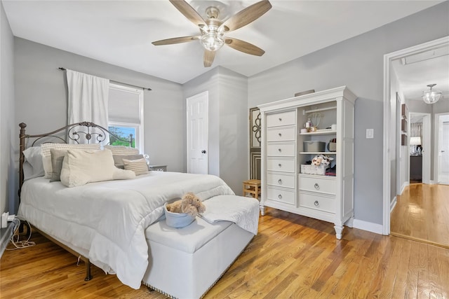243 Albemarle Rd, White Plains, NY 10605 - bedroom featuring attic access, light wood-style floors, a ceiling fan, and baseboards