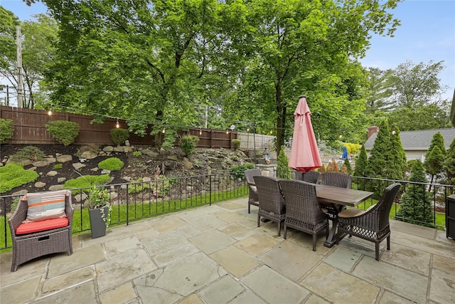 243 Albemarle Rd, White Plains, NY 10605 - fenced backyard featuring a patio and outdoor dining space