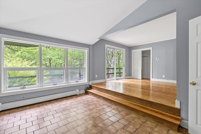 100 Schnackenberg Rd, Call Listing Agent, NY 12075 - empty room featuring a baseboard heating unit, lofted ceiling, and baseboards