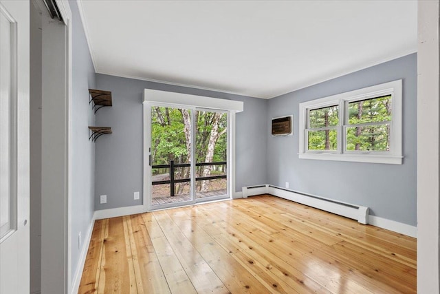 100 Schnackenberg Rd, Call Listing Agent, NY 12075 - empty room with a baseboard radiator, baseboards, hardwood / wood-style floors, ornamental molding, and a wall mounted AC