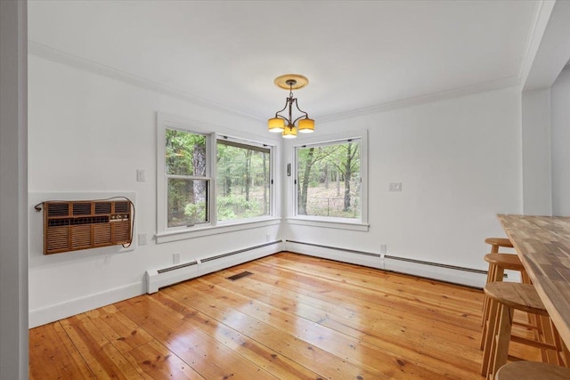 100 Schnackenberg Rd, Call Listing Agent, NY 12075 - unfurnished dining area featuring a chandelier, a wall mounted air conditioner, hardwood / wood-style flooring, ornamental molding, and baseboards