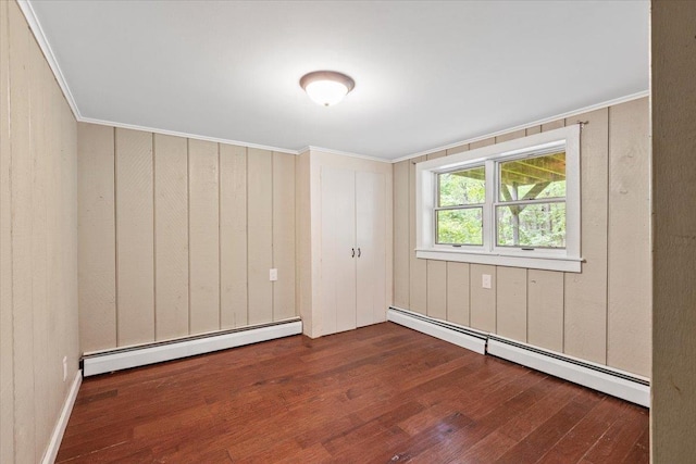 100 Schnackenberg Rd, Call Listing Agent, NY 12075 - unfurnished room with baseboard heating, wood finished floors, crown molding, and wood walls