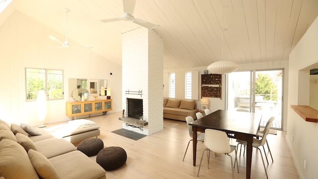 40 Elm Walk, Fair Harbor, NY 11706 - living area featuring a ceiling fan, healthy amount of natural light, lofted ceiling, wood finished floors, and a fireplace