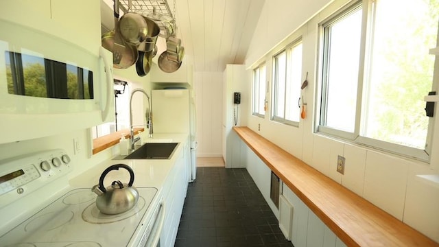 40 Elm Walk, Fair Harbor, NY 11706 - bathroom featuring a sink and vaulted ceiling