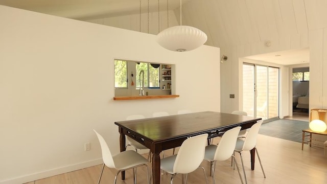 40 Elm Walk, Fair Harbor, NY 11706 - dining room featuring wood finished floors and high vaulted ceiling