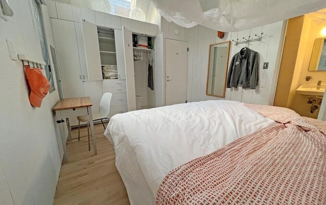 40 Elm Walk, Fair Harbor, NY 11706 - bedroom with light wood-style flooring and a closet