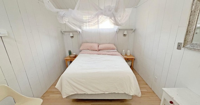40 Elm Walk, Fair Harbor, NY 11706 - bedroom with wood walls and light wood finished floors