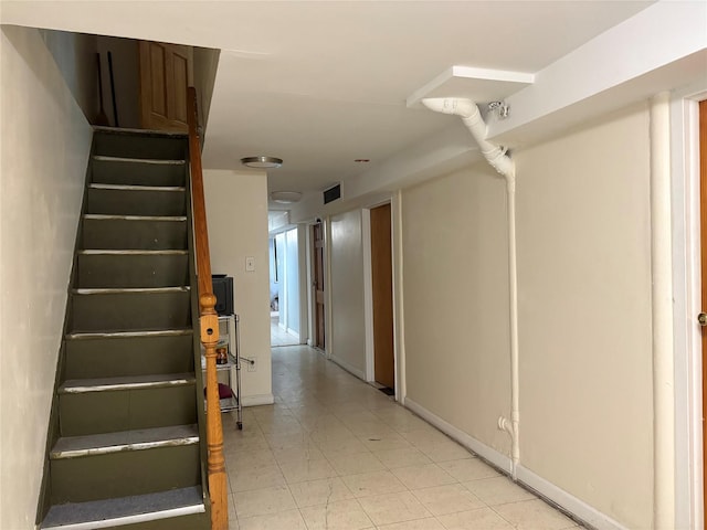 262 Grant Ave, Brooklyn, NY 11208 - stairway with tile patterned floors