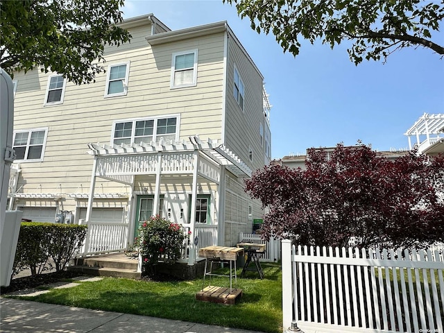 205 Aquatic Pl, Arverne, NY 11692 - view of front facade featuring a pergola