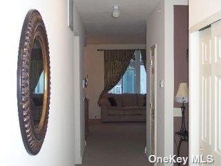 205 Aquatic Pl, Arverne, NY 11692 - corridor featuring plenty of natural light