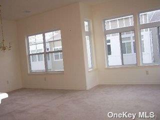 205 Aquatic Pl, Arverne, NY 11692 - spare room with carpet