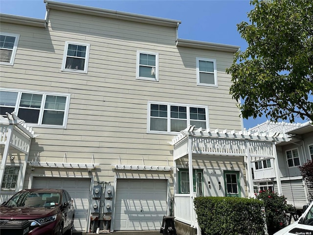 205 Aquatic Pl, Arverne, NY 11692 - back of property with an attached garage