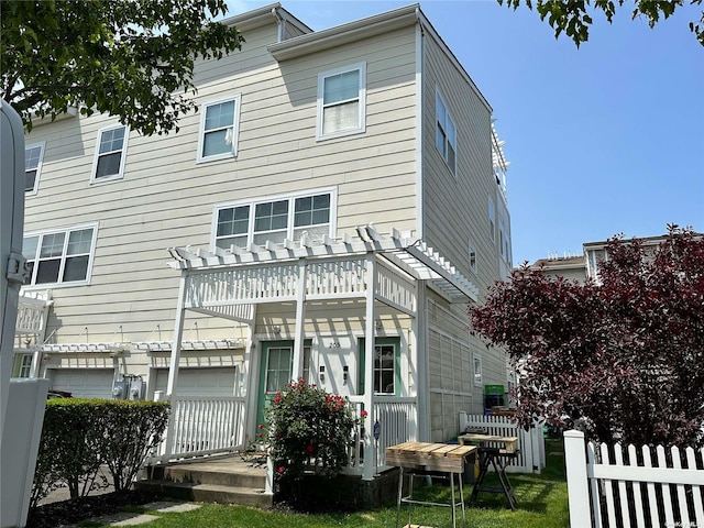 205 Aquatic Pl, Arverne, NY 11692 - back of house featuring a pergola