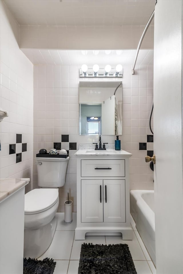 84-40 153rd Ave Unit 4F, Howard Beach, NY 11414 - full bathroom with vanity, tile walls, toilet, tile patterned flooring, and tub / shower combination