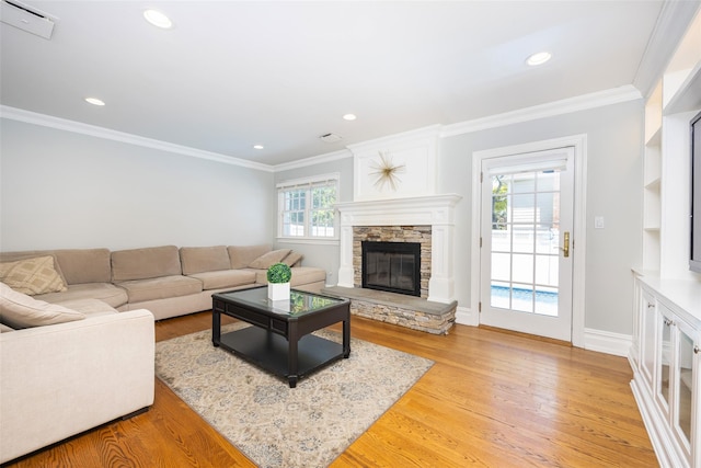 30 Knoll Ln, Glen Head, NY 11545 - living room with light wood finished floors, a fireplace, recessed lighting, crown molding, and baseboards